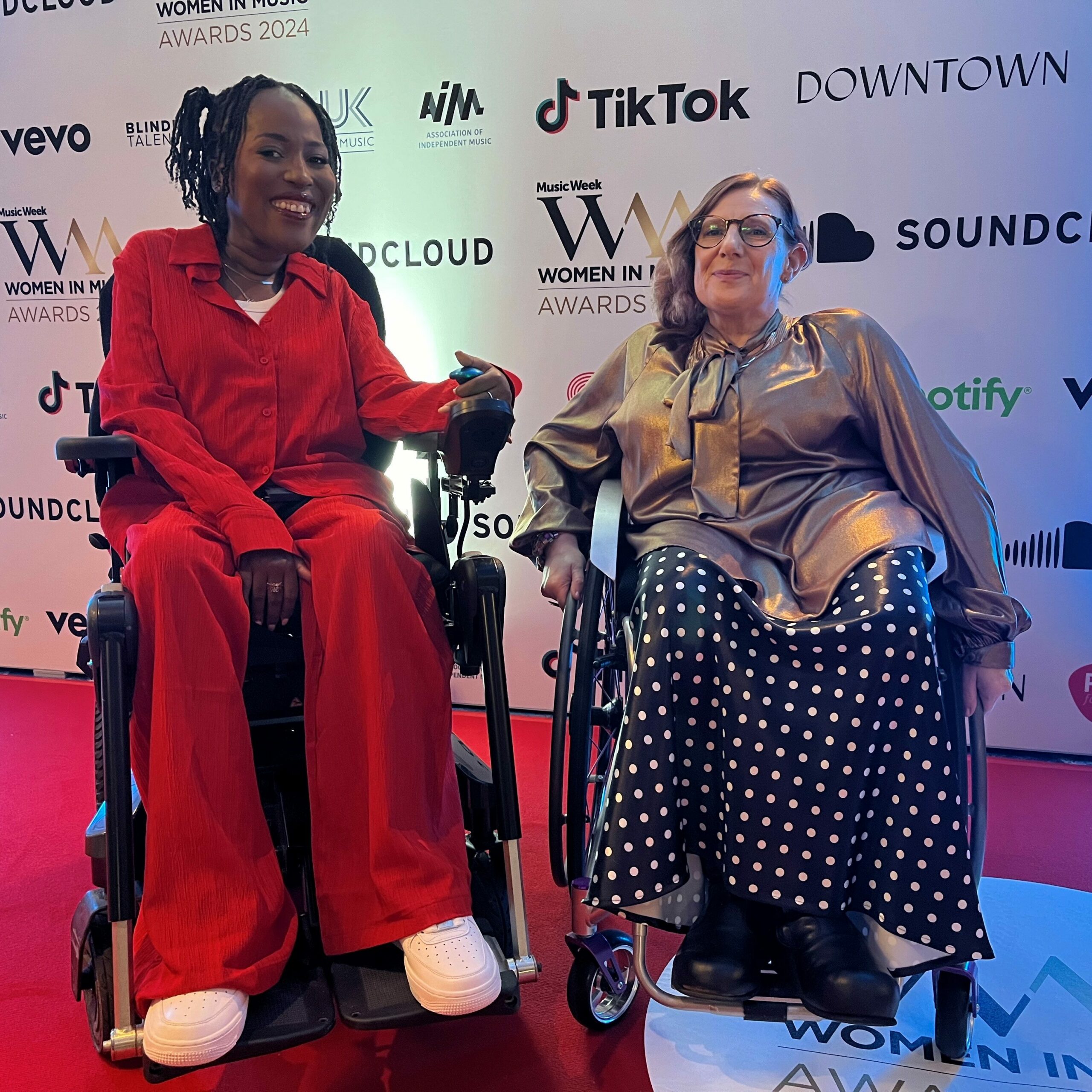 Co-chair of trustees Jacqui Adeniji-Williams with founder of Attitude is Everything Suzanne Bull MBE. They are both wheelchair users. They are at the Women in Music Awards 2024